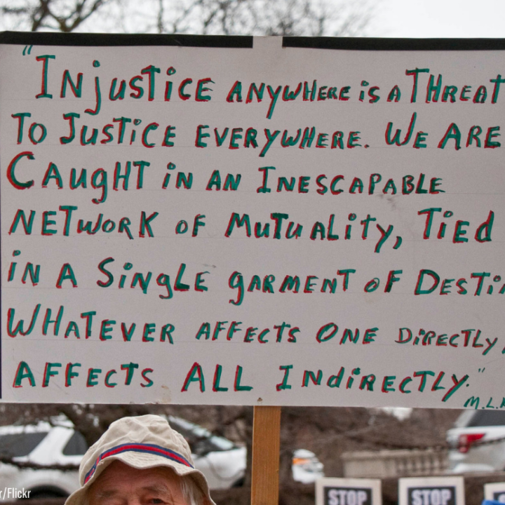 a sign quoting Martin Luther King "injustice anywhere is a threat to justice everywhere..."