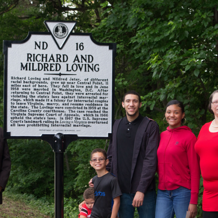 The Lovings' family standing in front of the historic marker dedicated to them.