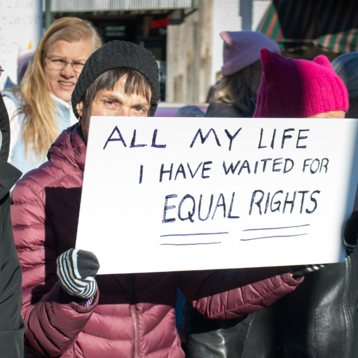 A woman holding a sign that said "All my Life I have waited for equal rights" at the Women's March in Richmond 