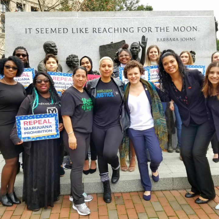 Group of advocates posing in front of Barbara Johns statue